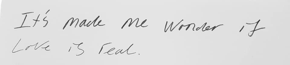 Handwritten note that says It's made me wonder if love is real.